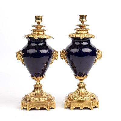 Lot 52 - A pair of ormolu mounted candlesticks