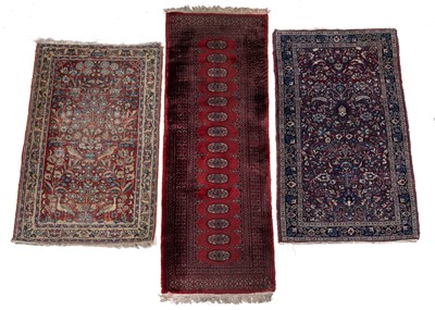 Lot 1255 - A group of three Persian rugs