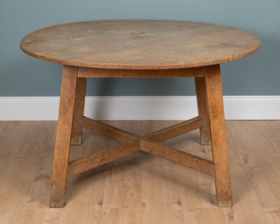 Lot 1041 - An early 20th century limed oak table in the manner of Heal's