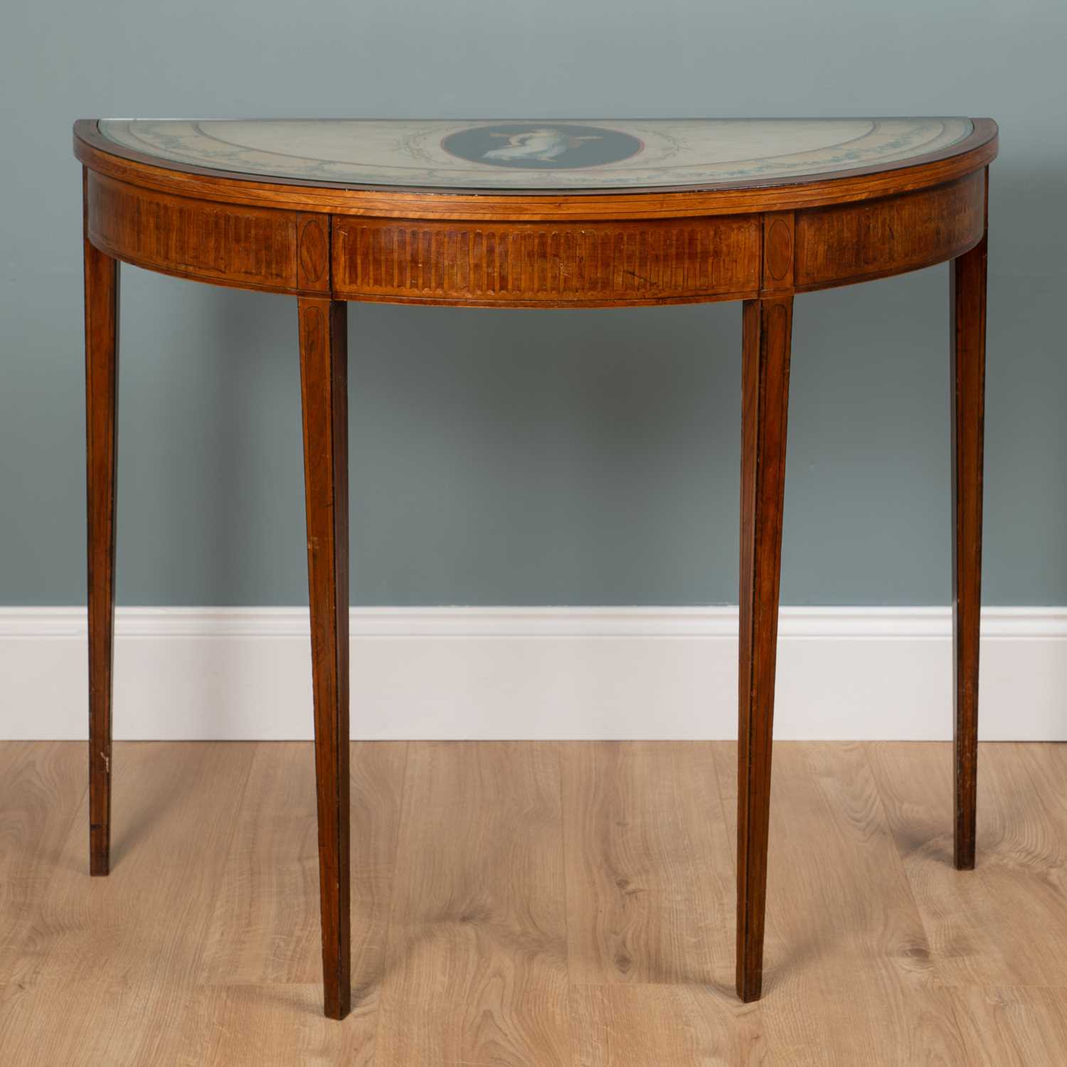 Lot 202 - A George III mahogany and satinwood inlaid demi-lune table