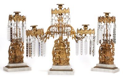 Lot 140 - A mid-19th century gilt metal and cut glass drop three-piece candelabra set