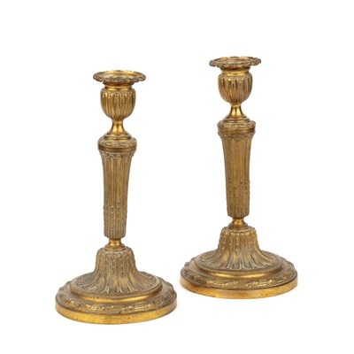 Lot 63 - A pair of 19th century French ormolu candlesticks