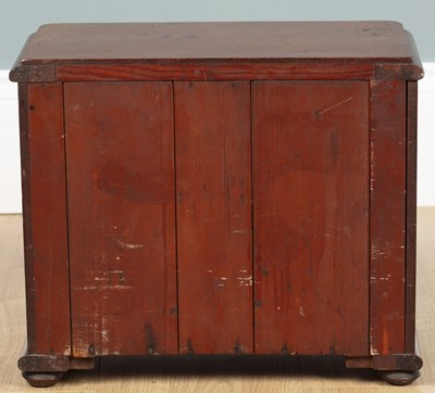 Lot 582 - A miniature chest of drawers