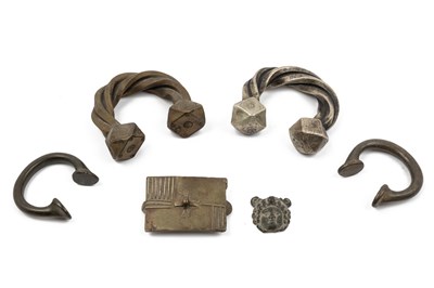 Lot 42 - A white metal Tuareg Manilla currency bracelet and further West African currency