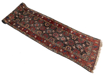 Lot 1285 - An antique Kurdish polychrome runner