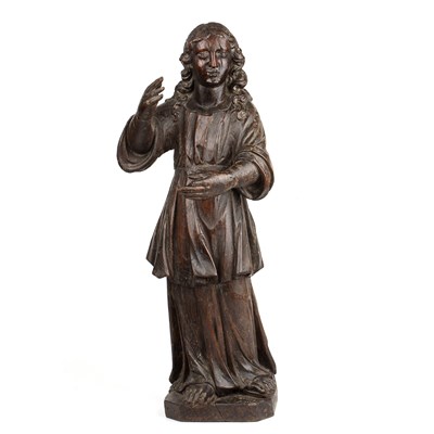 Lot 562 - A 17th century carved wooden figure of a saint