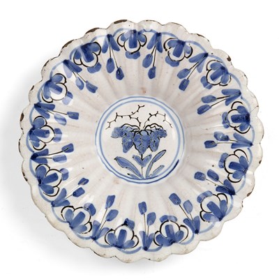 Lot 563 - A 17th/18th century Dutch Delft fluted dish