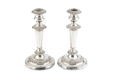 Lot 772 - A pair of George IV silver candlesticks, the...