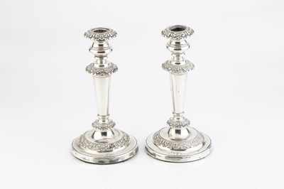 Lot 148 - A pair of George IV silver candlesticks, the...