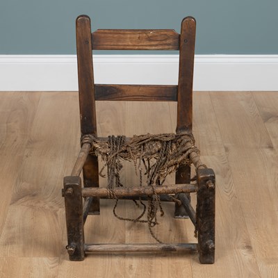 Lot 584 - A primitive child's chair