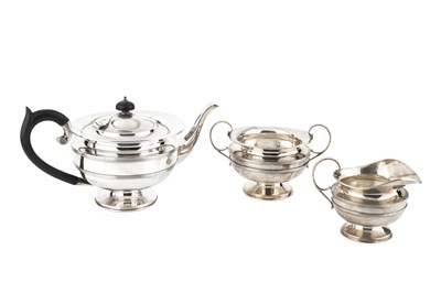 Lot 770 - A George V silver three piece tea service,...