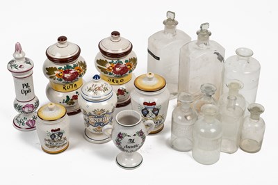 Lot 571 - Nine glass apothecary jars and a collection of fiance ware dry jug jars