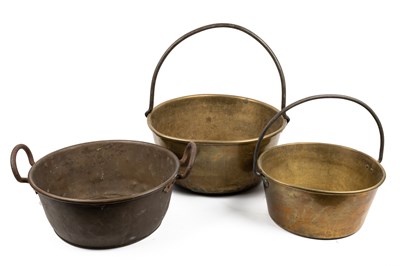 Lot 574 - A collection of three brass and copper jam pans