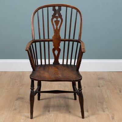 Lot 587 - A 19th century ash and elm Windsor armchair