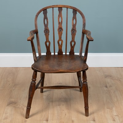 Lot 588 - A 19th century yew wood and elm Windsor armchair