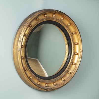 Lot 348 - A Georgian style gilt circular convex wall mirror