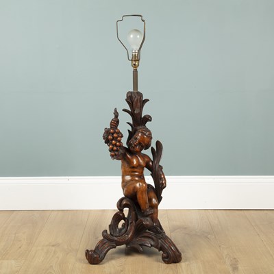Lot 592 - An Antique continental walnut table lamp
