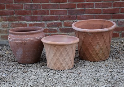 Lot 1422 - A group of three terracotta flower pots