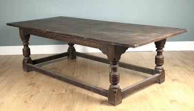 Lot 570 - A large Jacobean style oak refectory dining table