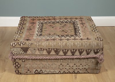 Lot 599 - A Kelim covered ottoman