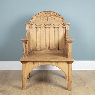 Lot 1057 - A late 19th or early 20th century pine throne chair