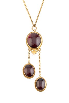 Lot 56 - A garnet negligée pendant necklace, the oval...