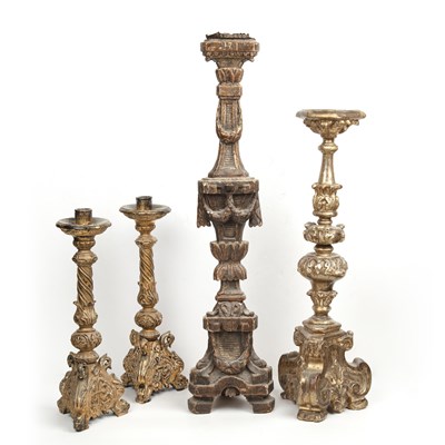 Lot 95 - Four giltwood carved candlesticks