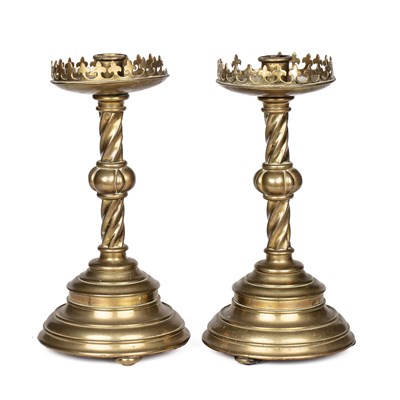 Lot 615 - A pair of 19th century brass candlesticks