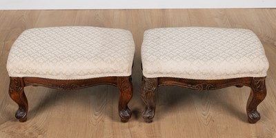 Lot 394 - A pair of carved wooden footstools