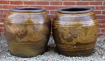 Lot 1348 - Two similar Chinese ovoid ceramic planters