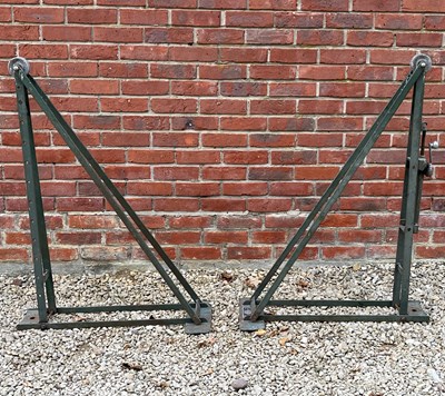 Lot 1357 - A pair of folding tennis court posts