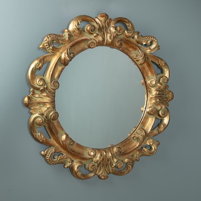 Lot 720 - A circular wall mirror