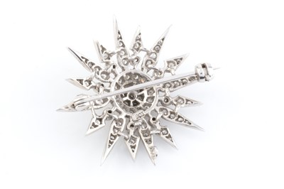 Lot 268 - A diamond sunburst brooch, set throughout with...