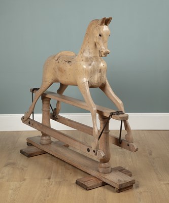 Lot 609 - A stripped pine rocking horse