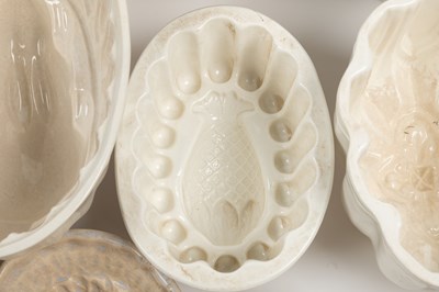 Lot 576 - A collection of old ceramic jelly moulds
