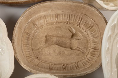 Lot 576 - A collection of old ceramic jelly moulds