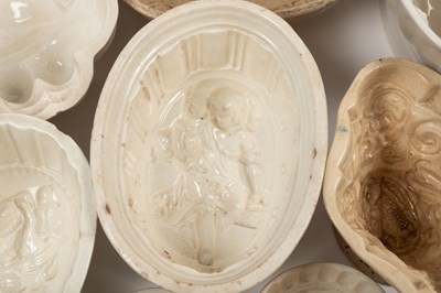 Lot 576 - A collection of old ceramic jelly moulds