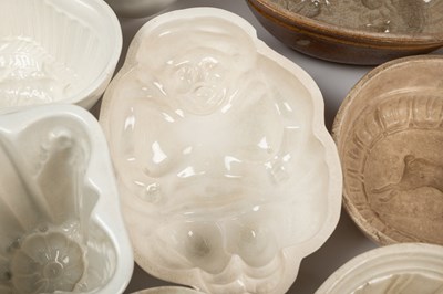 Lot 576 - A collection of old ceramic jelly moulds