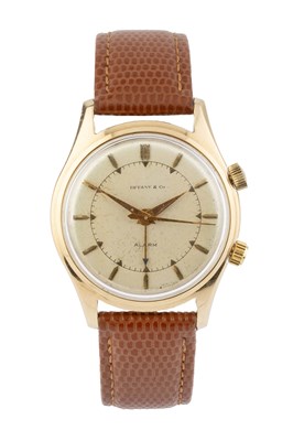 Lot A gentleman's alarm wristwatch by Tiffany & Co....