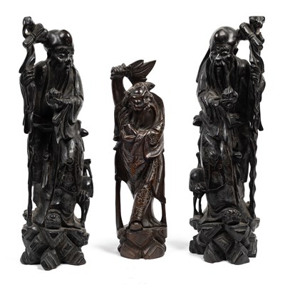 Lot 353 - Three Chinese hardwood figures of wise men