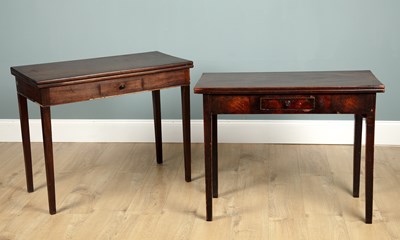 Lot 215 - A near pair of 19th century mahogany fold-over tea tables