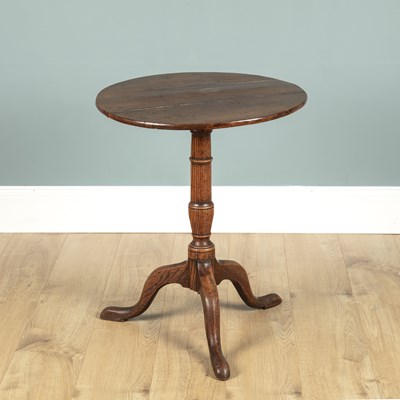 Lot 642 - A 19th century fruitwood tilt-top occasional table