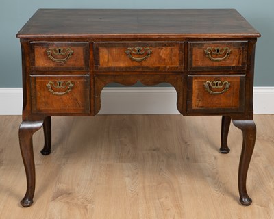 Lot 709 - A Georgian mahogany lowboy