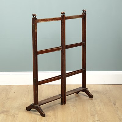 Lot 647 - An Arts & Crafts oak folding towel rail