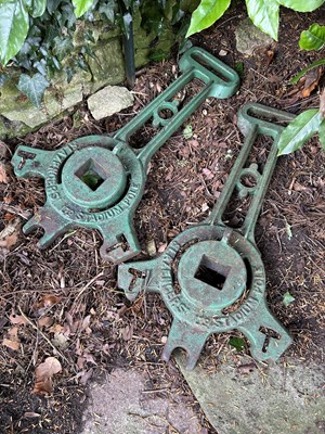 Lot 1463 - A pair of old cast iron grass tennis court post supports