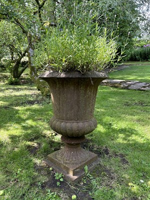 Lot 1350 - An old cast iron urn