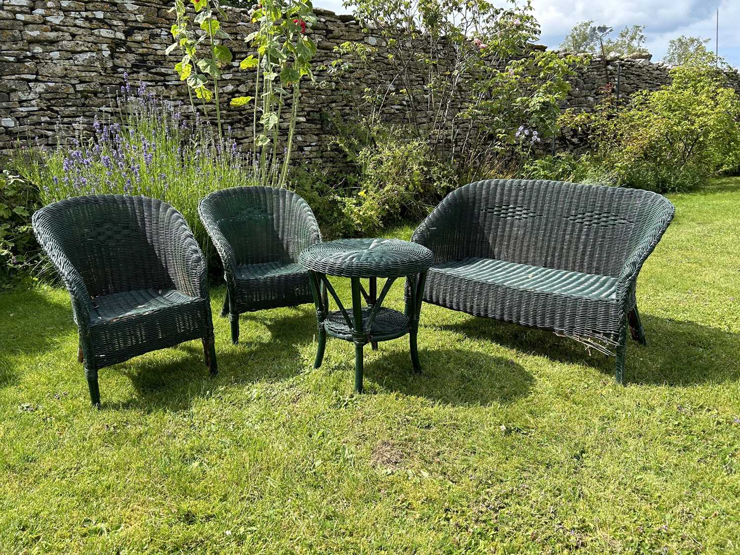 Lot 1360 - A set of child's green-painted wicker Lloyd Loom style garden furniture