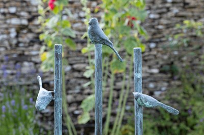 Lot 1462 - A group of three bronze garden sculptures