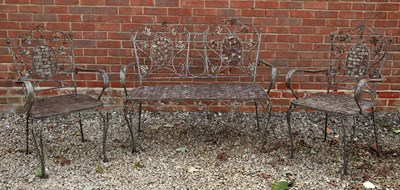 Lot 1381 - A wrought iron garden seat and two armchairs