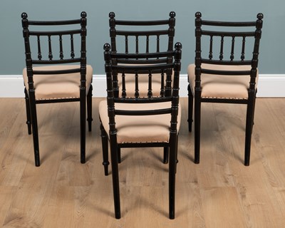 Lot 74 - A set of four Victorian ebonised Arts & Crafts movement side chairs